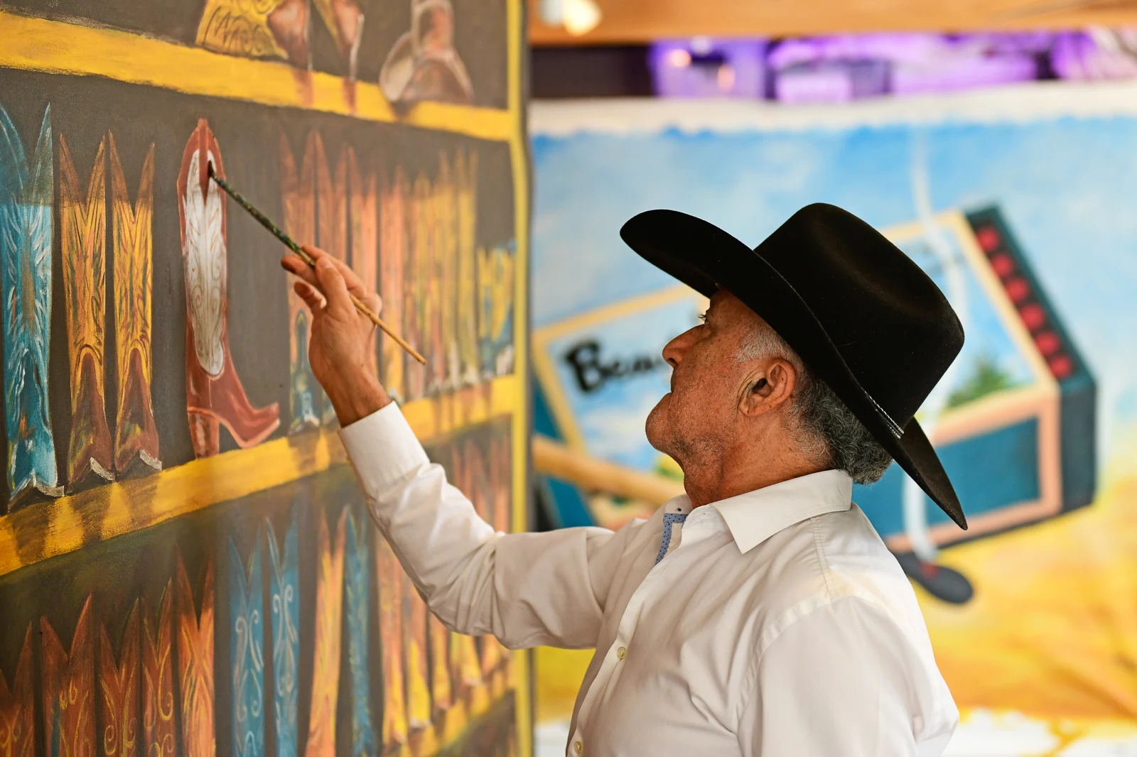 Michael Krief painting the Western Boots commission