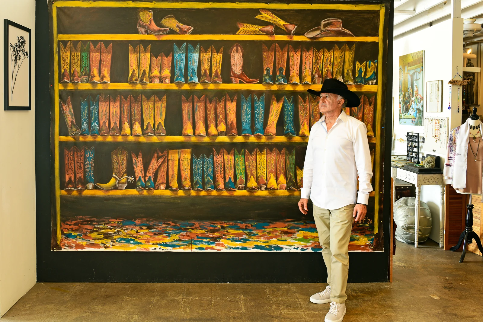 Michael Krief beside the large Western Boots commission